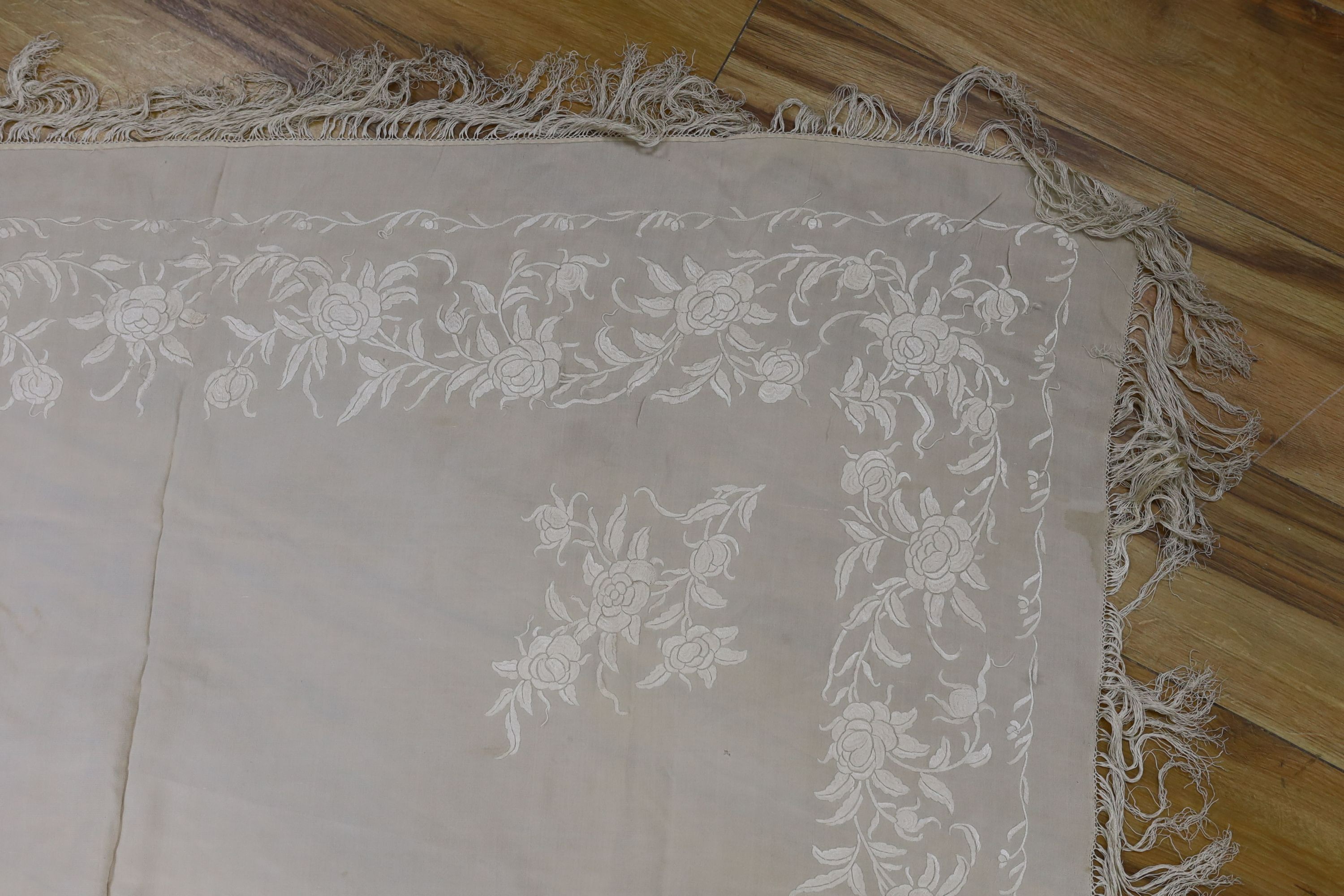 A 19th century cream embroidery on cream silk shawl together with a smaller later shawl